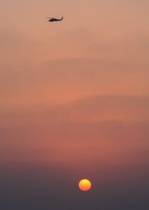 Seahawk patrols at sunset 141017-N-GW139-041