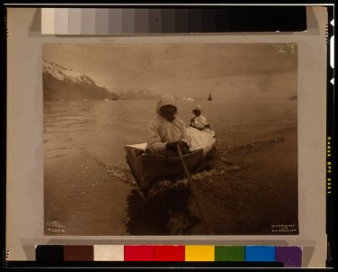 Seal hunters in canoe at Glacier Bay - Curtis. LCCN00649754