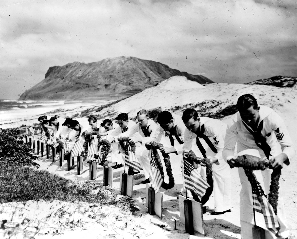 Seamen at Kaneohe NAS decorate graves of Pearl Harbor victims