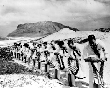 Seamen at Kaneohe NAS decorate graves of Pearl Harbor victims