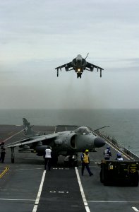 Sea Harrier FA2 801 NAS hovers over HMS Illustrious (R06) 2001