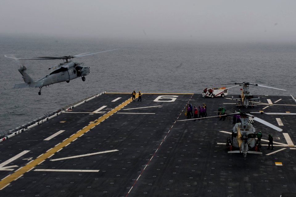 Seahawk lands aboard future USS America in transit to San Francisco 141006-N-MZ309-039