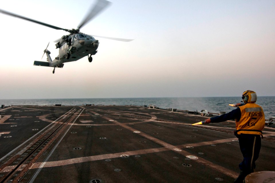 Seaman Joseluis Robles directs the take-off of a SH-60B Sea Hawk helicopter (8592584380)