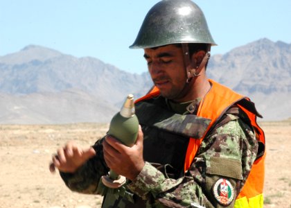 An Afghan National Army mortar instructor prepares an 82 MM Russian Mortar (4705394107)