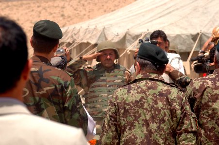 An Afghan National Army soldier greets Members of Parliament, various Province Representatives and Consolidated Fielding Center leadership (4763808740) photo