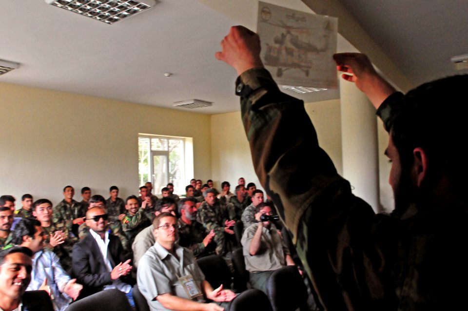 An Afghan National Army soldier who successfully completed the Aircrew Chief course holds up his graduation certificate (4543189370)