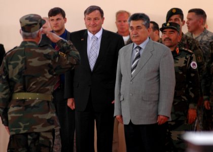An Afghan Army Soldier salutes and welcomes U.S. Ambassador for Afghanistan, Karl Eikenberry and General Mohammad Amayoon Raizee (4724589232)
