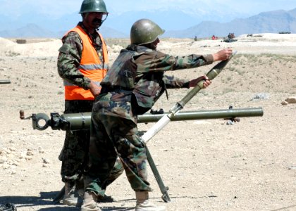 An Afghan National Army trainee prepares a mortar round for loading into a Russian Recoilless Rifle (SPG-9) (4705400143)