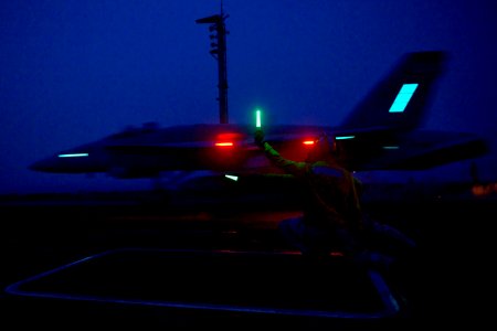 An aircraft launches at night. (8434691481)