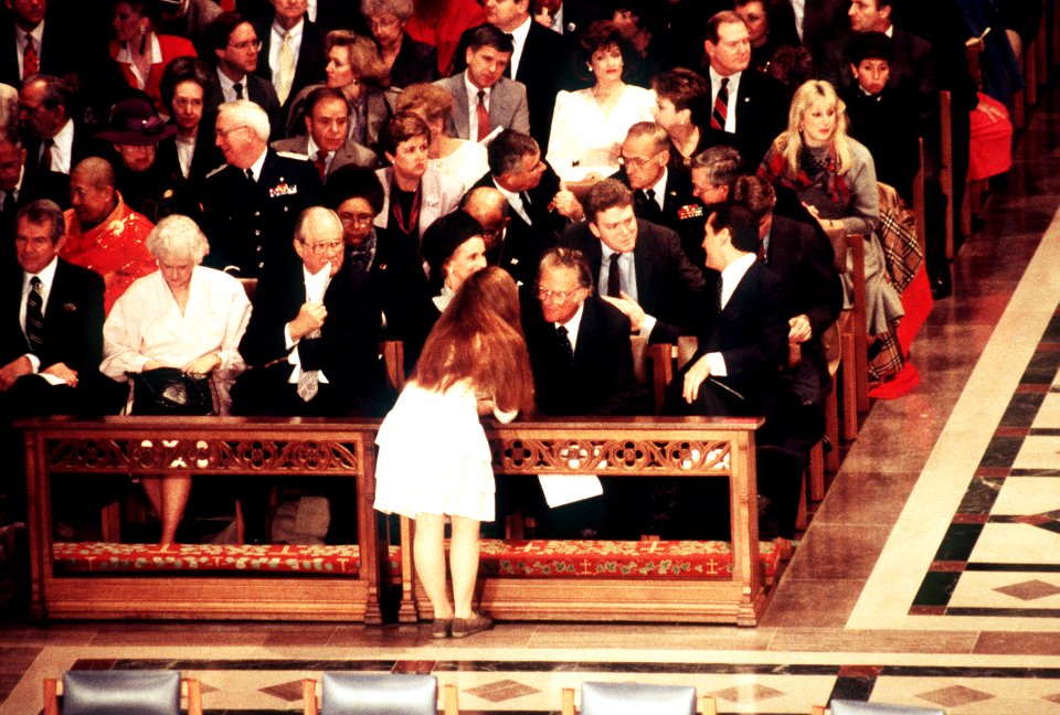 An attendant at the National Prayer Service converses with Billy Graham