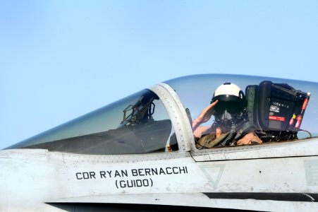 An aviator salutes before take off at sea. (8591439129)