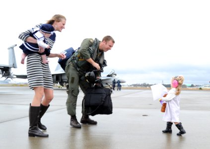 An aviator is welcomed home by his daughter. (8202184485)