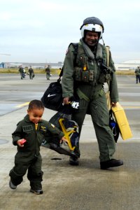 An aviator walks with his son after returning home. (8203283160)