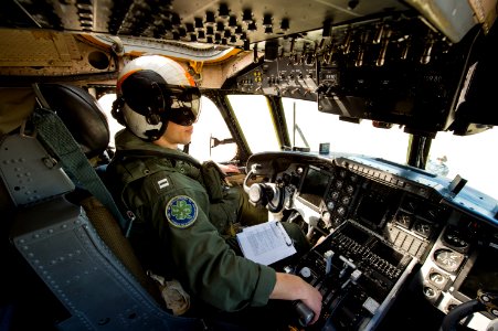An aviator sits in a C-2 Greyhound before takeoff. (8411306964)