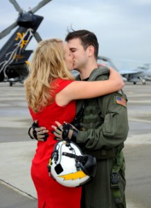 An aviator kisses his wife after coming home. (8203283258)