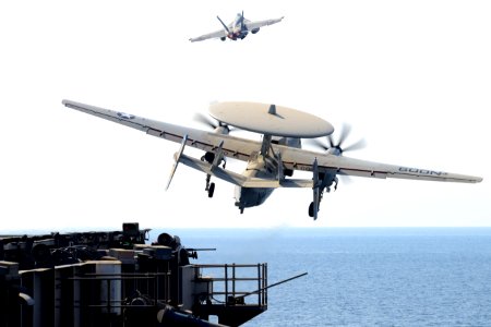 An E-2C Hawkeye and an F-A-18E Super Hornet launch at sea. (8413079515)