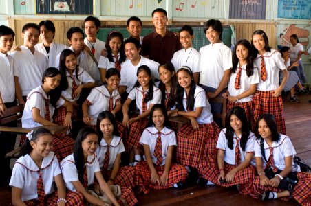 An Education Volunteer with his high school students in the Philippines