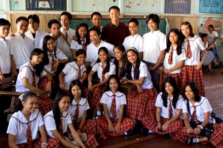 An Education Volunteer with his high school students in the Philippines photo