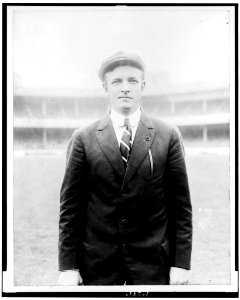 Christy Mathewson, half-length portrait, standing, facing front, on baseball field LCCN92506953