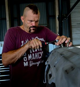 Chuck “The Iceman” Liddell, a retired American mixed martial artist, tightens a bolt photo