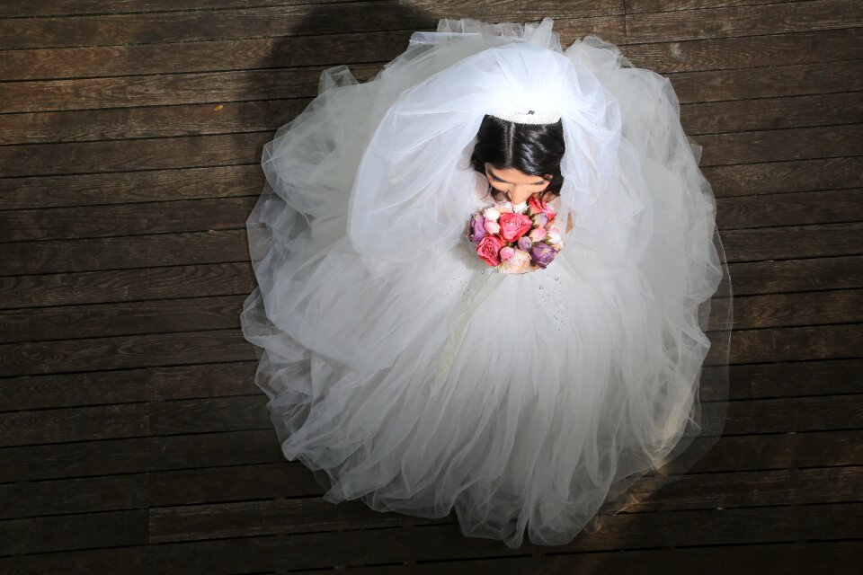 Bride in wedding dress bride with flowers brown wedding