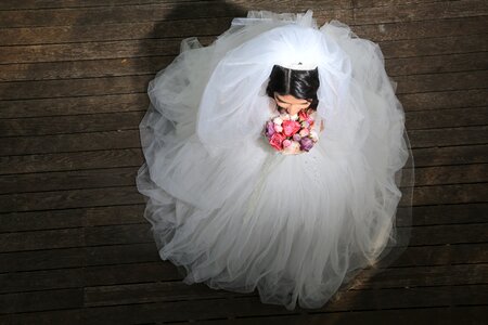 Bride in wedding dress bride with flowers brown wedding