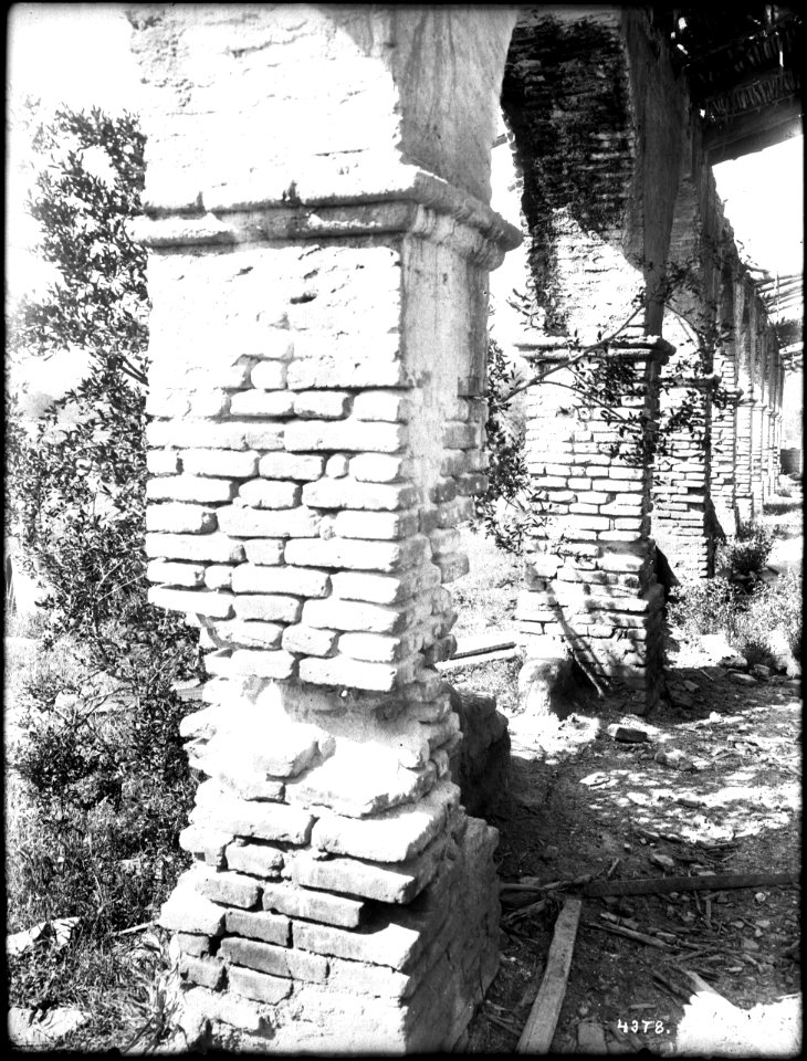 Crumbling brick pillars of the corridor at Mission San Antonio de Padua, California, ca.1906 (CHS-4378)