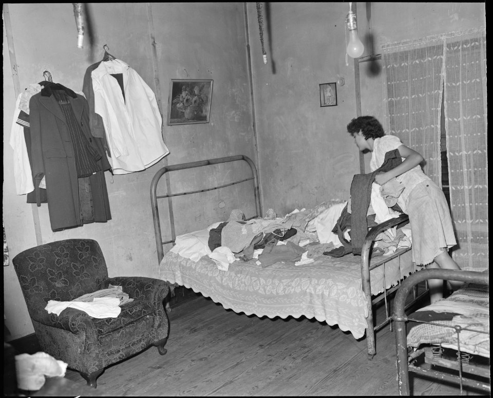 Daughter of Archie Isreal, miner. Two adults and five children live in this three room house which rents for $5.25... - NARA - 541124