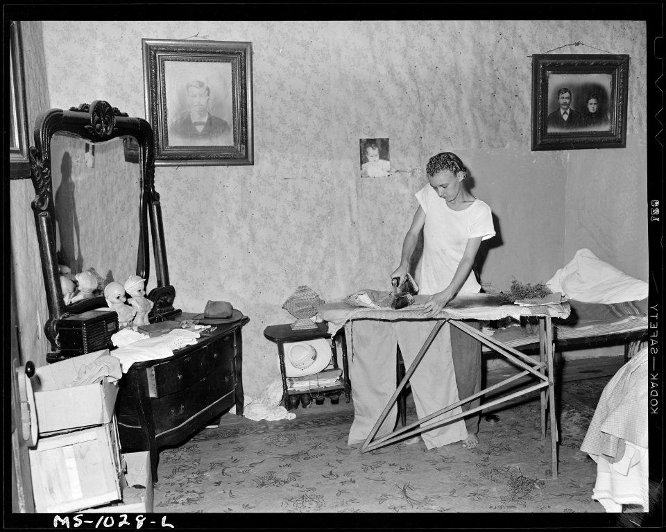 Daughter of Luther Nixon ironing. He owns his own farm. He works on Paul Reese Coal Company, Lease, Le Flore County... - NARA - 540654