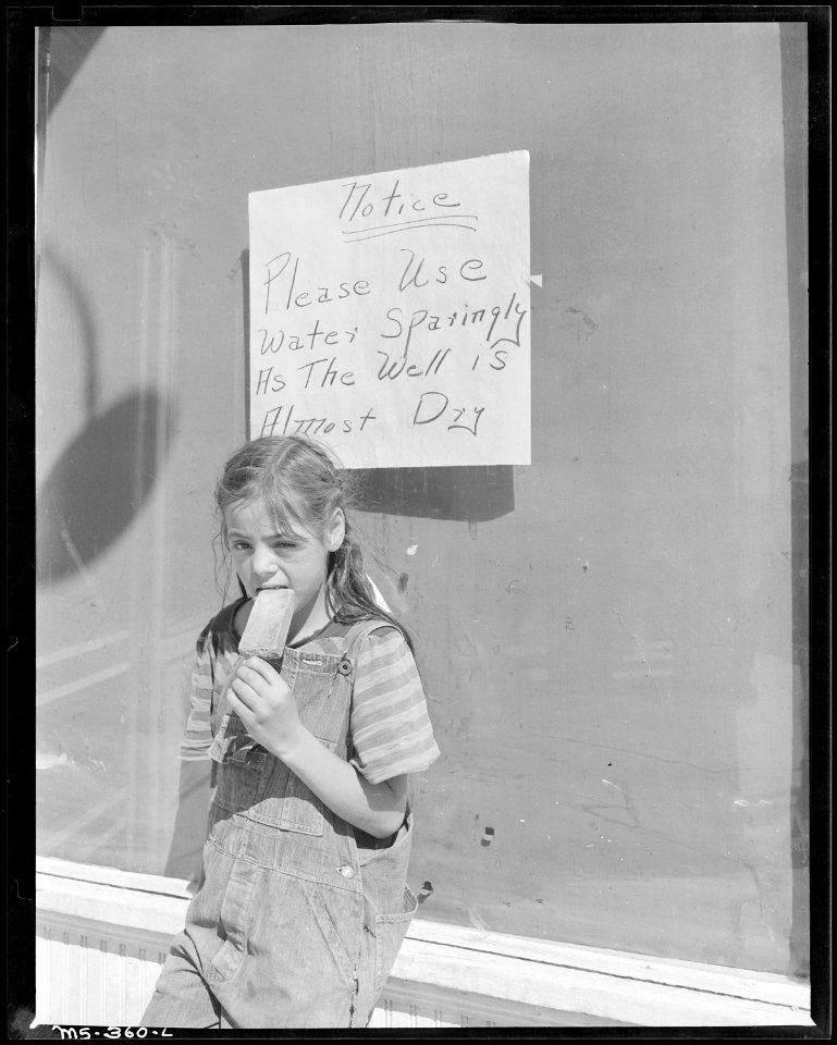 Daughter of miner in front of company store. Calumet Fuel Company, Delcarbon ^2 Mine, Delcarbon, Huerfano County... - NARA - 540371