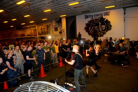 Delta Rae performs aboard USS Bataan 140725-N-MW280-021