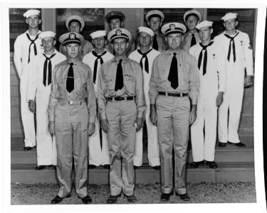 80-G-244701 Lt Crist, Lt Cmdr. Kaufmann, and Lt Carberry awards