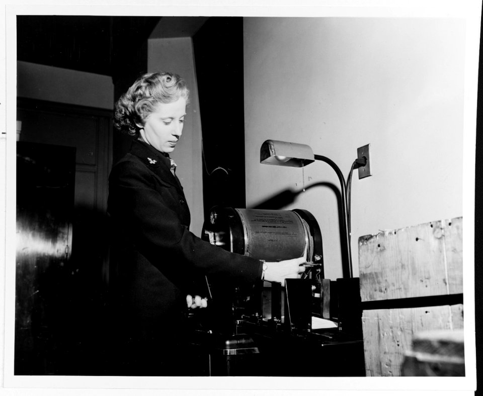 80-G-27797 - Yeoman operating a ditto machine (1943)