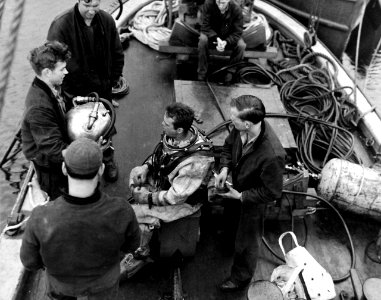 80-G-279823 Montague Island, Gulf of Alaska, Alaska, 1945. Salvage diver onboard ship