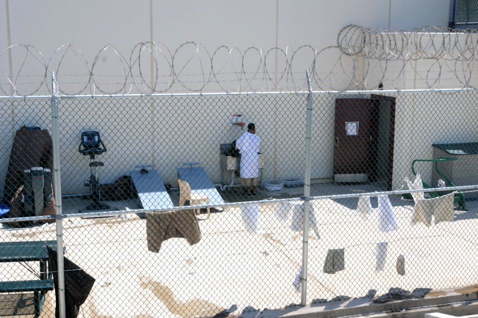 A detainee uses a sink in the outdoor recreation area of Camp Six at Joint Task Force Guantanamo DVIDS380262
