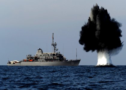 A demolition charge detonates 1,500 meters from Avenger-class mine countermeasures ship USS Scout (MCM 8). The charge was built and detonated by Sailors assigned to Explosive Ordnance Disposal Mobile Unit