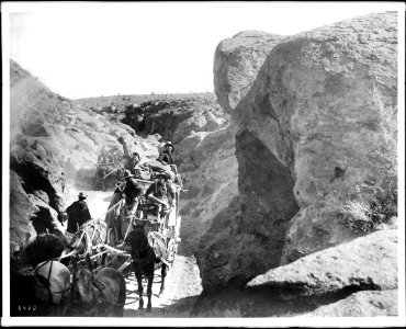 A desert stage going through a canyon heading towards Goldfield, Nevada, ca.1900 (CHS-5428) photo