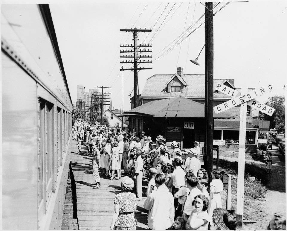 A crowd gathered at a railroad station, perhaps that at Bolivar, Missouri, to greet the presidential train. President... - NARA - 199880