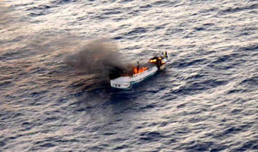 A fire burns aboard the Taiwanese fishing vessel Shin Maan Chun in the Pacific Ocean 120421-N-ZZ999-003