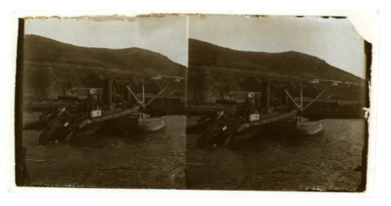 A destroyed Russian warship being salvaged by a smaller boat, Port Arthur LCCN2005678601