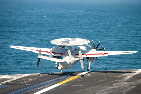 A French Navy E-2C Hawkeye aircraft assigned to the French aircraft carrier Charles de Gaulle (R 91) performs a touch-and-go landing on the aircraft carrier USS Harry S. Truman (CVN 75) during carrier 140114-N-ZG705-199