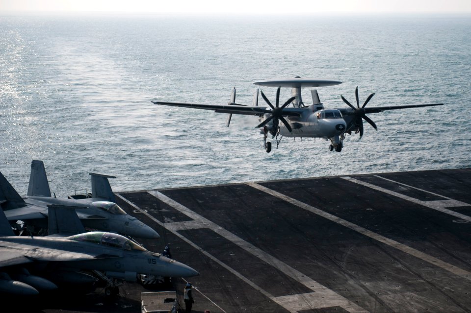 A French Navy E-2C Hawkeye aircraft assigned to the French aircraft carrier Charles de Gaulle (R 91) performs a touch-and-go landing on the aircraft carrier USS Harry S. Truman (CVN 75) during carrier 140114-N-ZG705-210