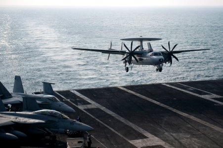 A French Navy E-2C Hawkeye aircraft assigned to the French aircraft carrier Charles de Gaulle (R 91) performs a touch-and-go landing on the aircraft carrier USS Harry S. Truman (CVN 75) during carrier 140114-N-ZG705-210
