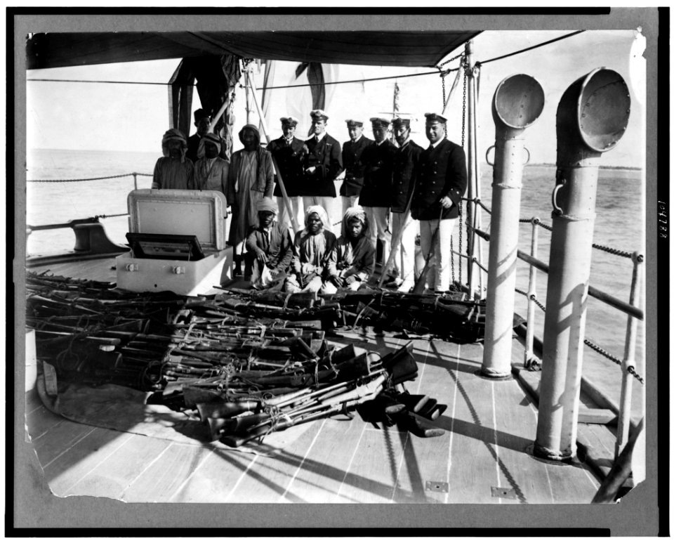 Arms traffic. The disaster at Dibai. The surrendered rifles on the quarter deck of the HMS Fox LCCN92501011