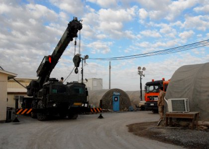 Armored crane and shipping containers outside the ROLE 3 Hospital on Kandahar Airport -a