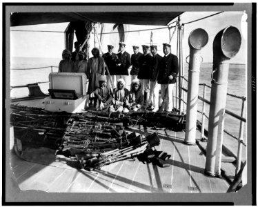 Arms traffic. The disaster at Dibai. The surrendered rifles on the quarter deck of the HMS Fox LCCN92501011 photo