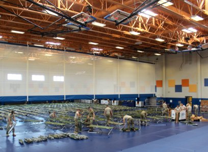 Army National Guard and Reserve Soldiers set up cots at gym as Hurricane Matthew approaches the eastern tip of Cuba. (29998933962)