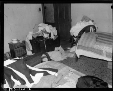 Bedroom of home of Mrs. Eloise Smith, widow of miner. Mrs. Smith lives in company housing project. Industrial... - NARA - 540285