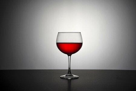 Glass of wine darkness red wine