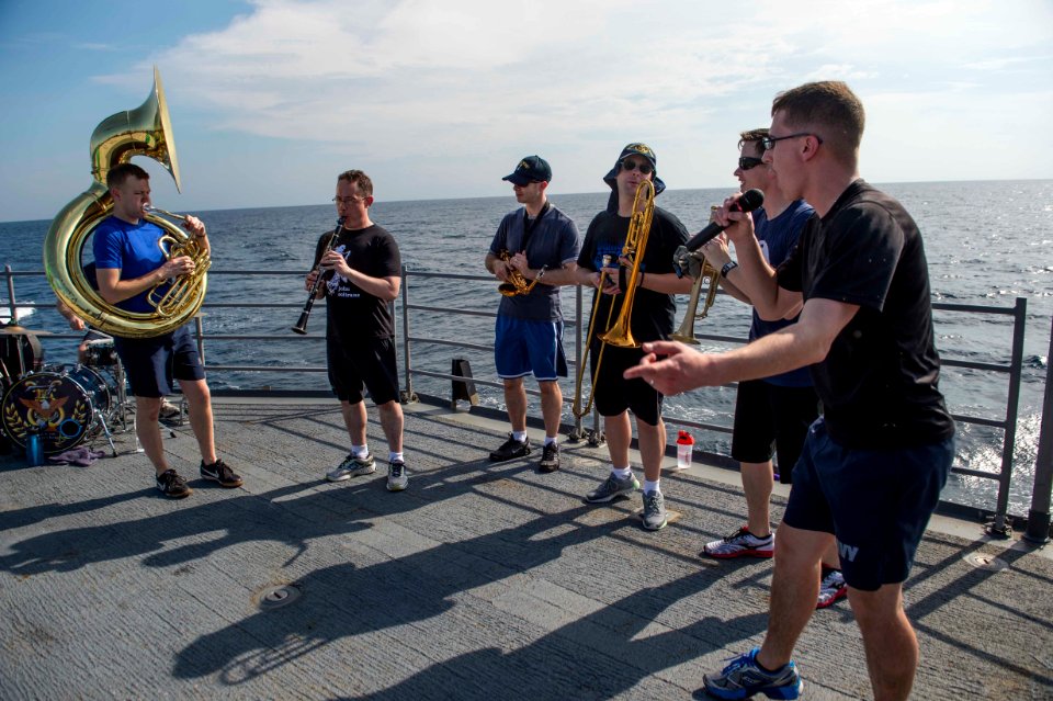C7F Band puts on a show aboard USS Antietam enroute to the International Fleet Review 160131-N-ZZ786-234